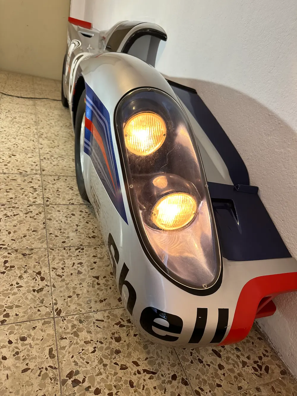 Illuminated Half of a Porsche 917 Martini Racing Wall Decor — Sold