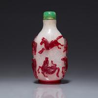 A Chinese Ruby Overlay 'Eight Horses of Wang Mu' Snuff Bottle, 19th Century 清中期 雪霏地套寶石紅料穆王八駿鼻烟壺