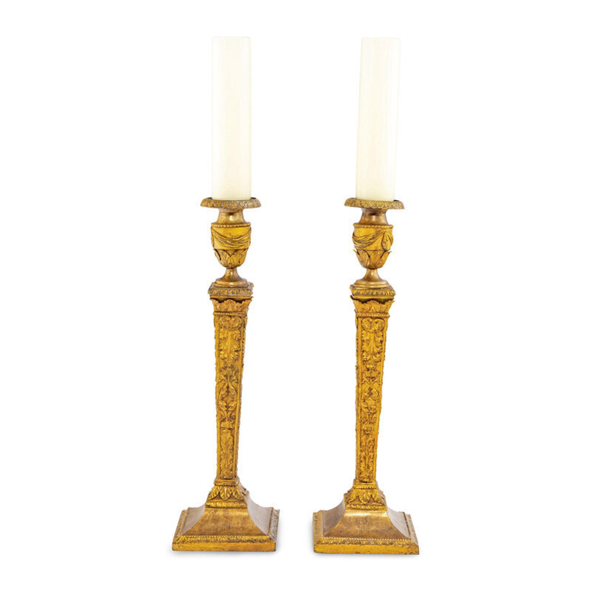 A Pair of Continental Gilt Iron Candlesticks