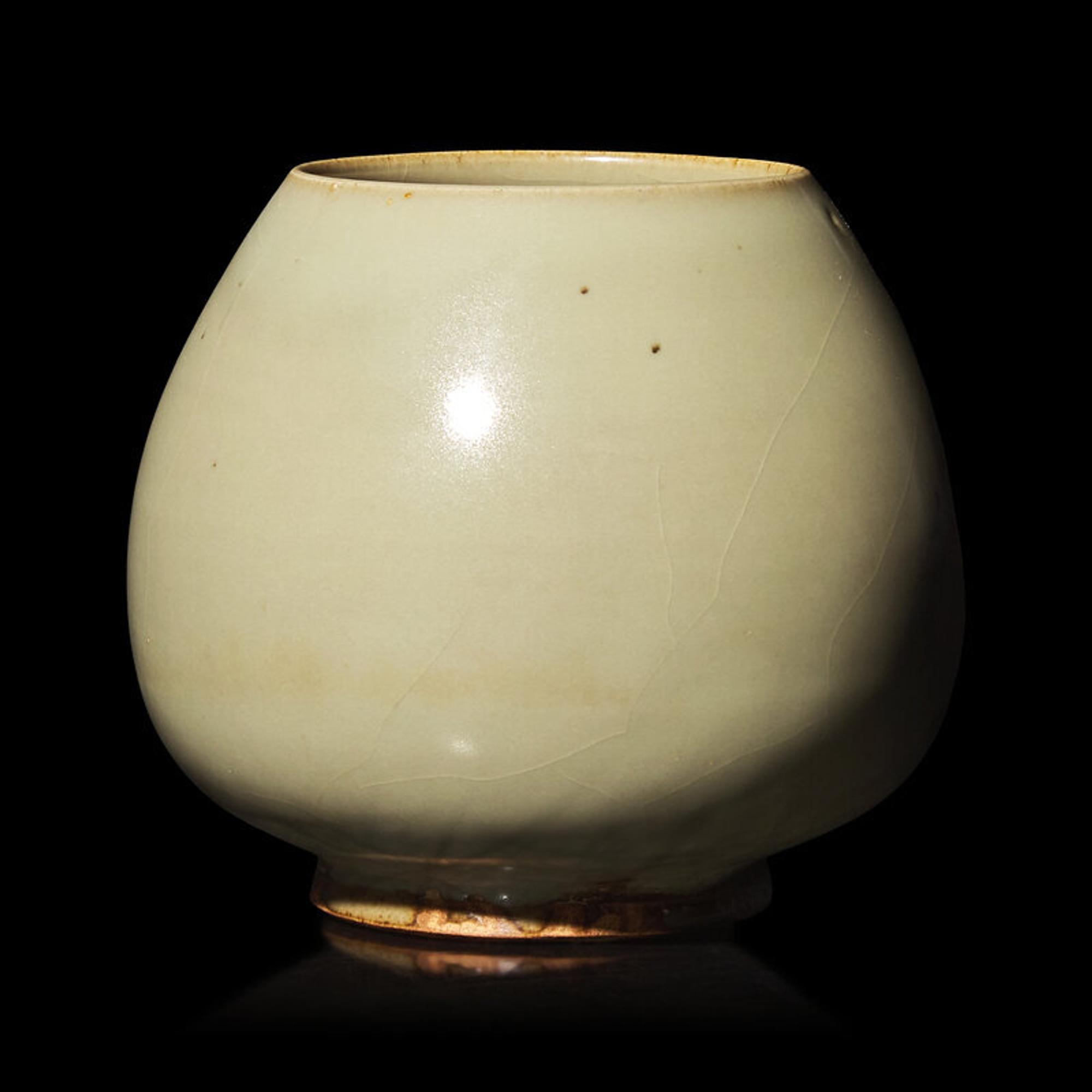 A Chinese Green-Glazed 'Lotus Bud' Vessel, Junyao or Ruzhou Donggou Kilns, Jin Dynasty 金 鈞窯或汝洲東溝窰綠釉鷄心罐