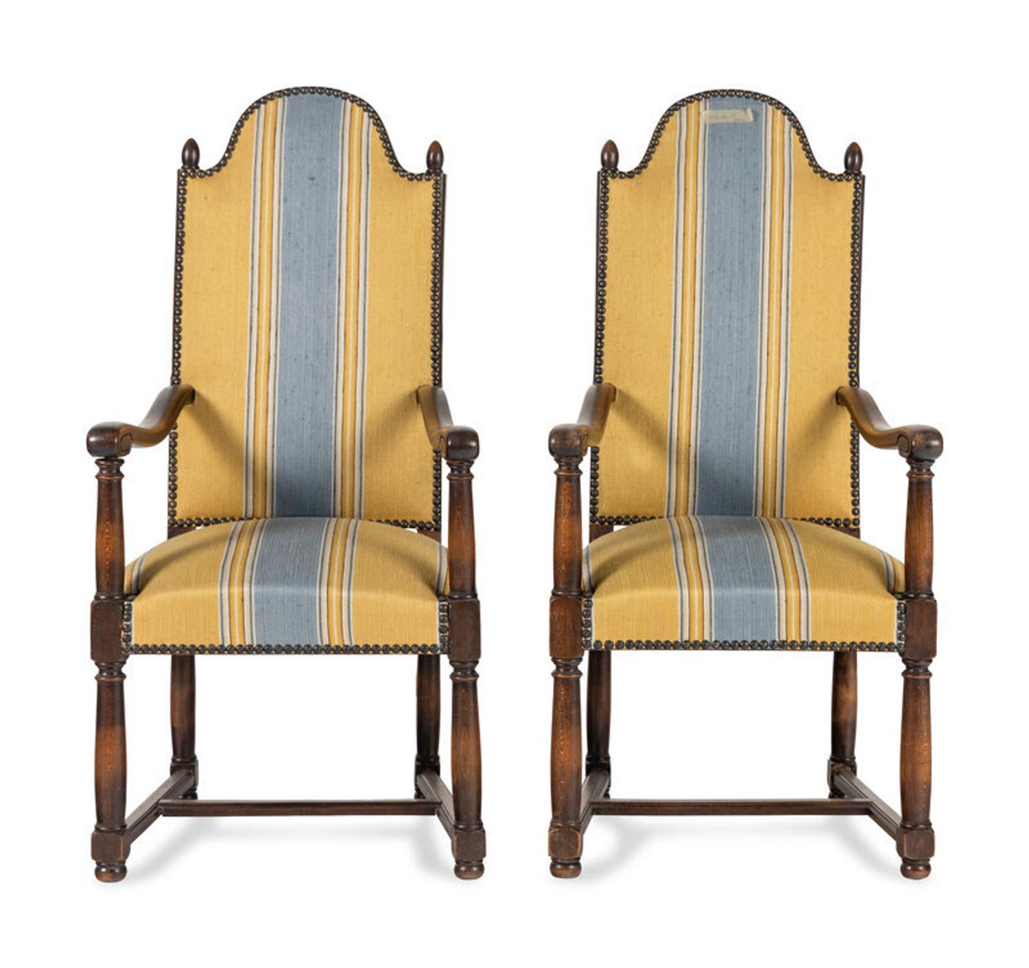 A Pair of French Provincial Carved Oak Fauteuils