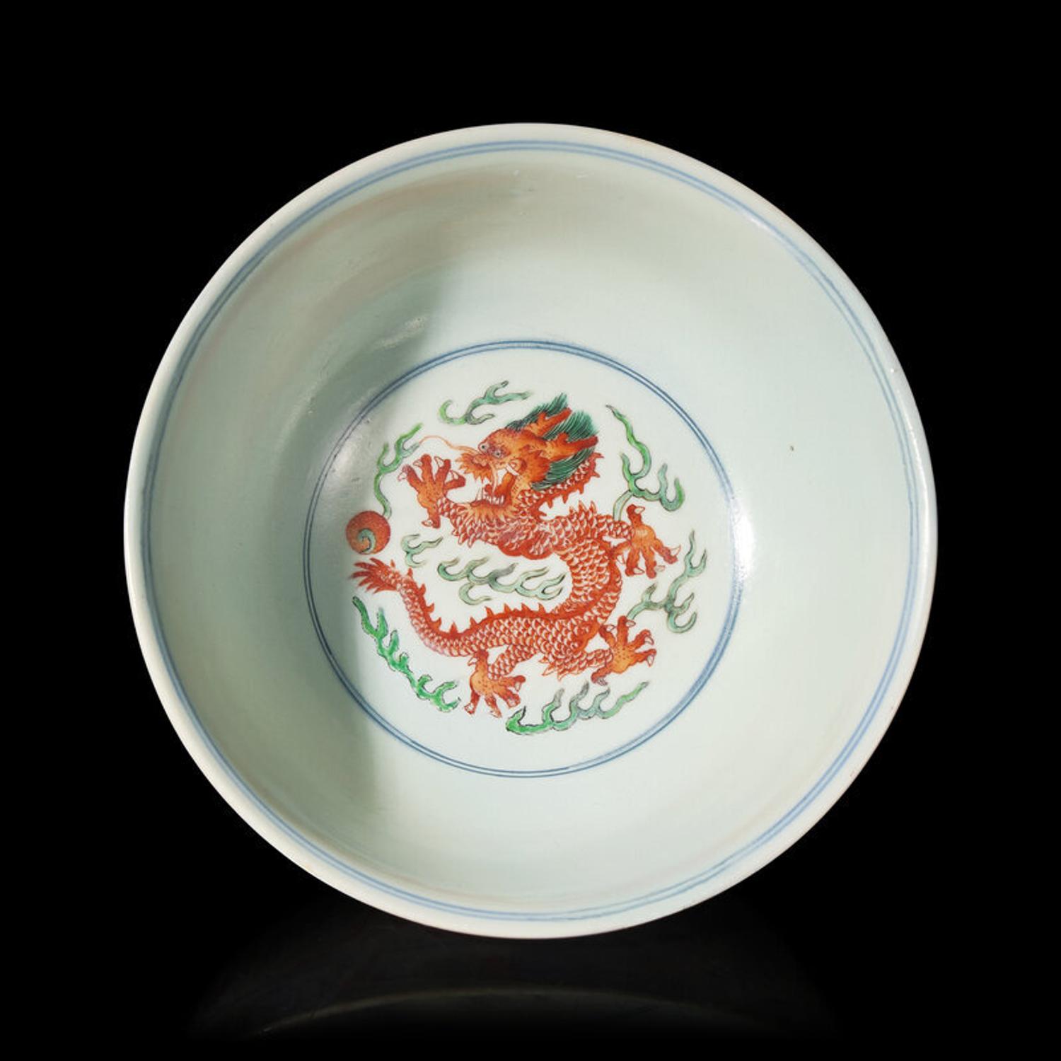 A Chinese Wucai Porcelain 'Dragon and Phoenix' Bowl, Qianlong Mark and of The Period 清乾隆 五彩龍鳳紋宮盌