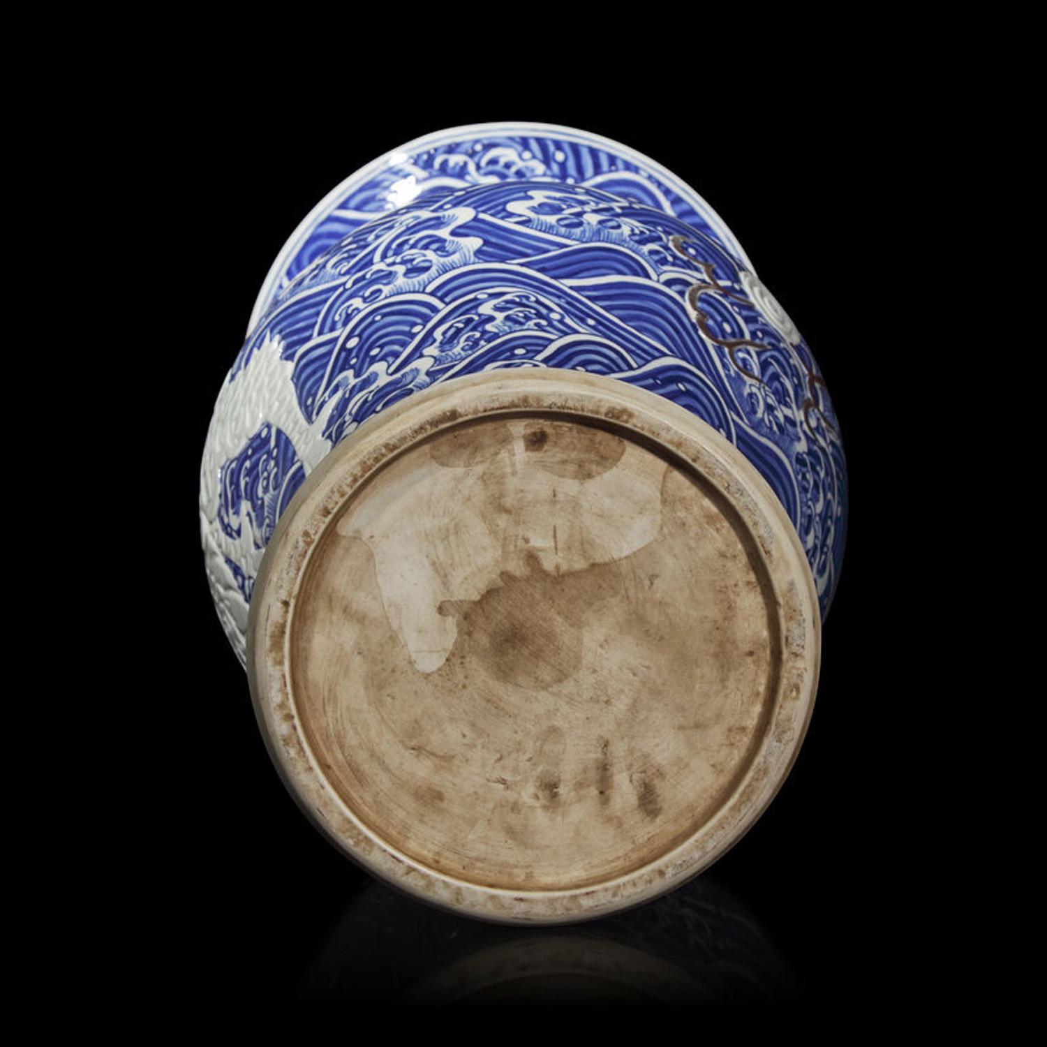A Large Japanese Carved Blue and White and Red Porcelain 'Kylin on Waves' Vase, Meiji Period 日本明治時期 青花麒麟紋大瓶