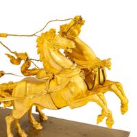 An Empire Gilt Bronze Figural Mantel Clock