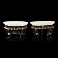 A Pair of Chinese White Jade 'Chrysanthemum' Dishes, Qing Dynasty to Republic Period 晚清-民國 白玉菊瓣盤一對