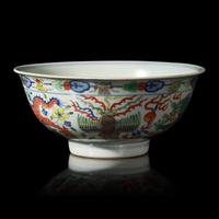 A Chinese Wucai Porcelain 'Dragon and Phoenix' Bowl, Qianlong Mark and of The Period 清乾隆 五彩龍鳳紋宮盌