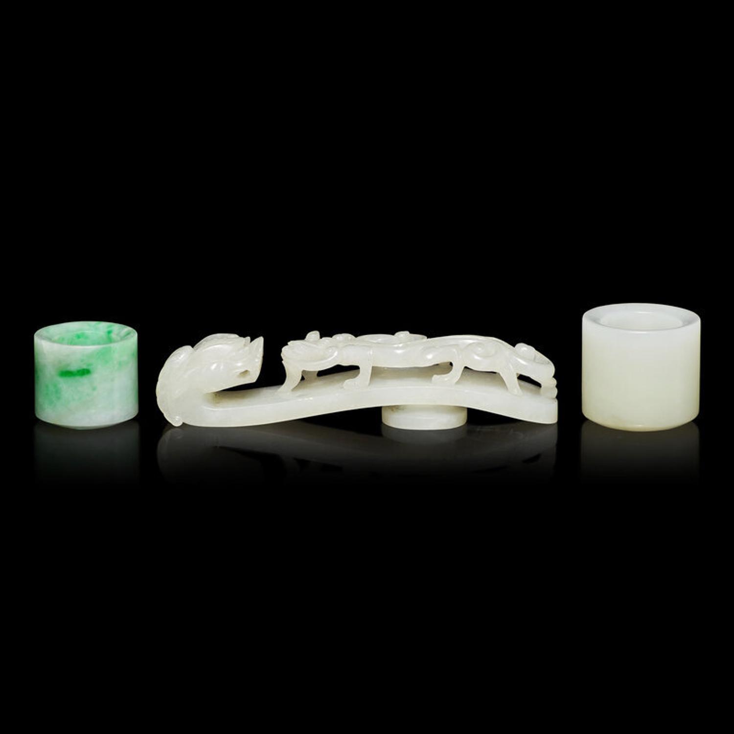 Two Chinese Jade and Jadeite Archer's Rings and a Jade 'Dragon' Belt Hook, Qing Dynasty 清 白玉、翡翠扳指及龍鈎一組三件