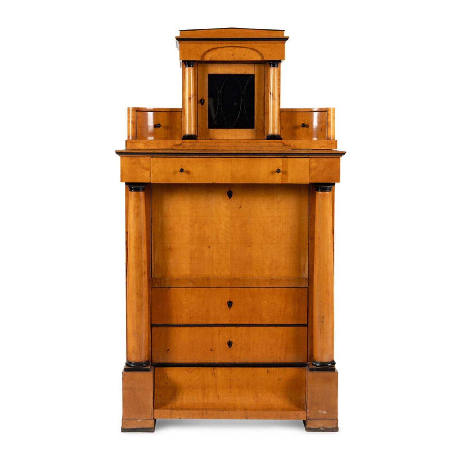 A Biedermeier Part-Ebonized Birch Bureau Cabinet
