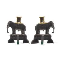 A Pair of French Patinated and Gilt Bronze Elephant-Form Chenets
