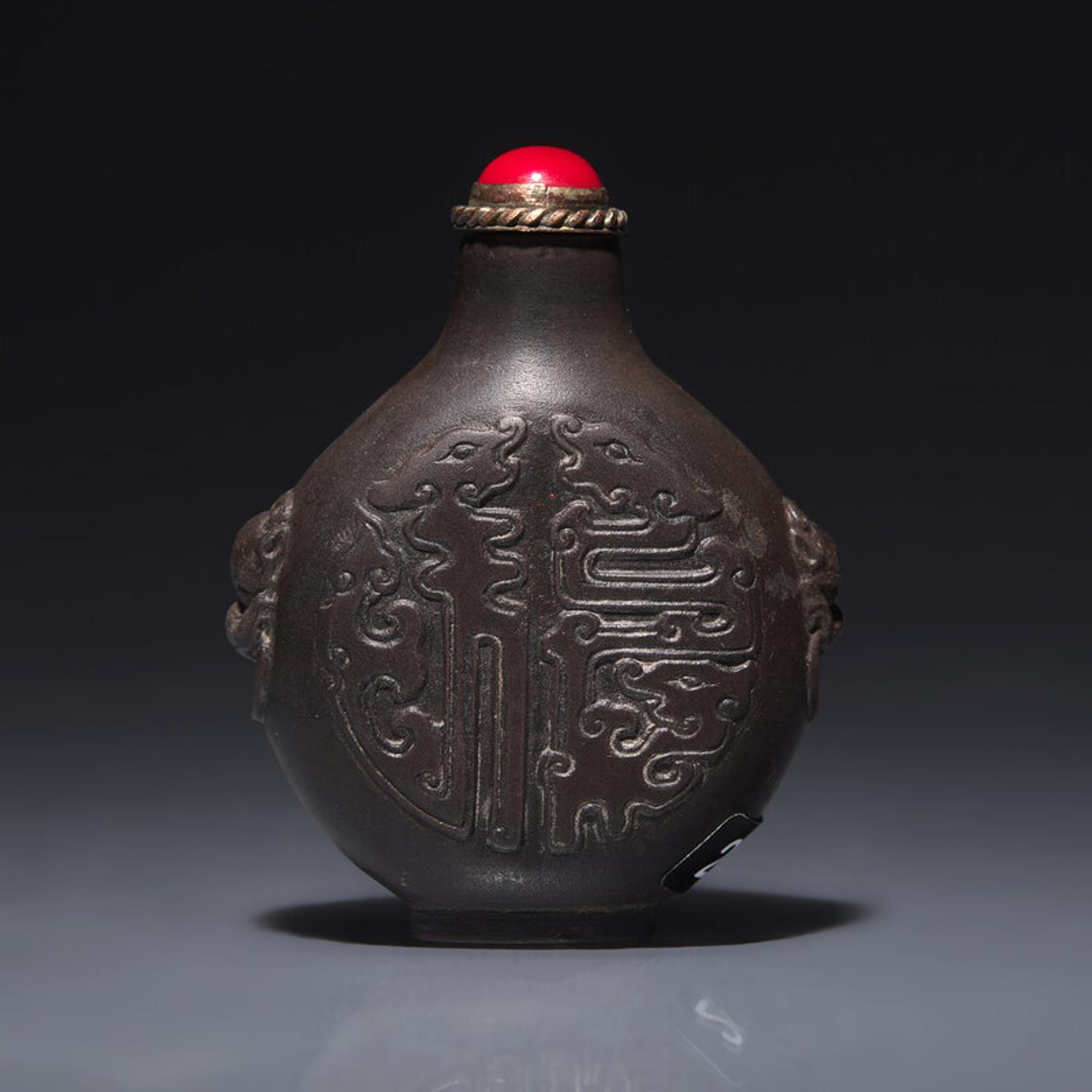 A Chinese Carved Duan Stone Snuff Bottle, Circa 1750-1820 1750-1820年 端石刻龍紋鼻烟壺