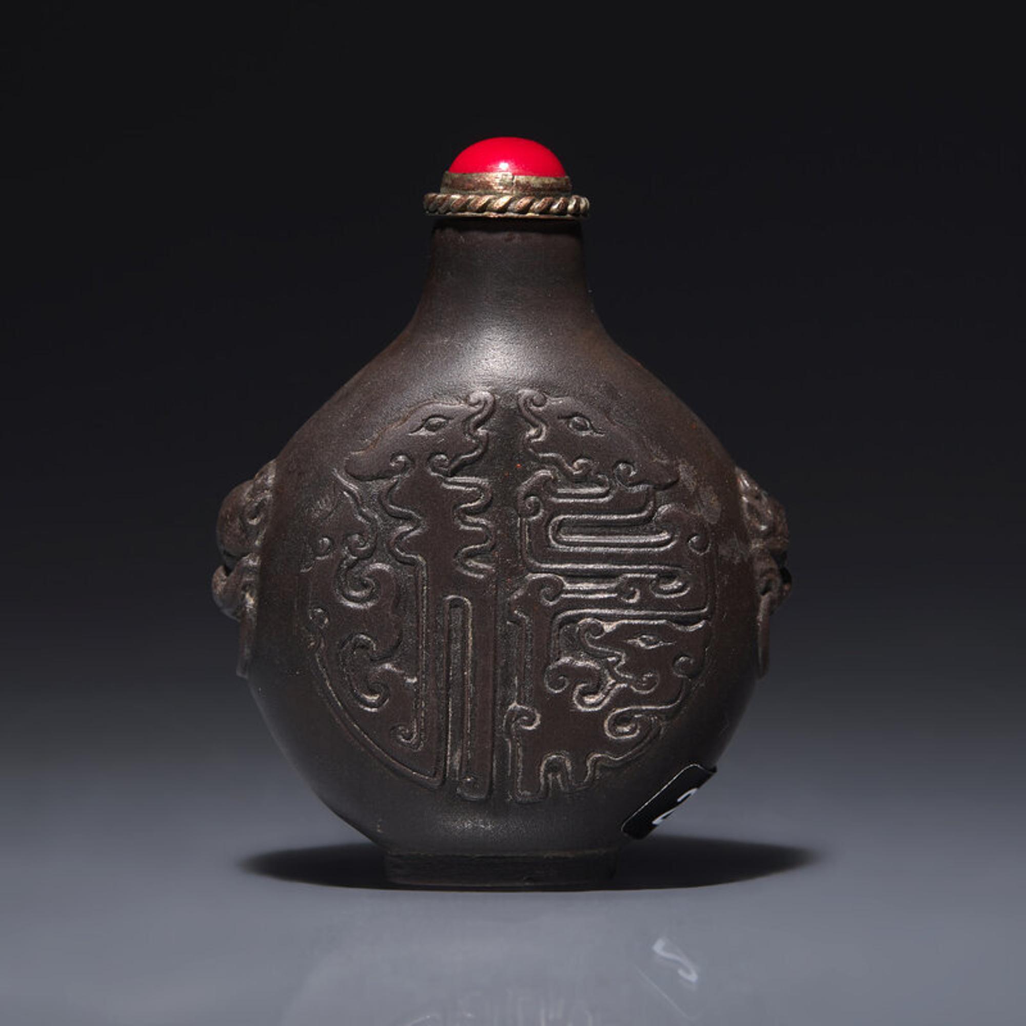 A Chinese Carved Duan Stone Snuff Bottle, Circa 1750-1820 1750-1820年 端石刻龍紋鼻烟壺