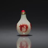 A Chinese Miniature Red-Overlaid Opaline Glass Snuff Bottle, Circa 1750-1820 1750-1820年 涅白地套寶石紅料螭龍紋小鼻烟壺