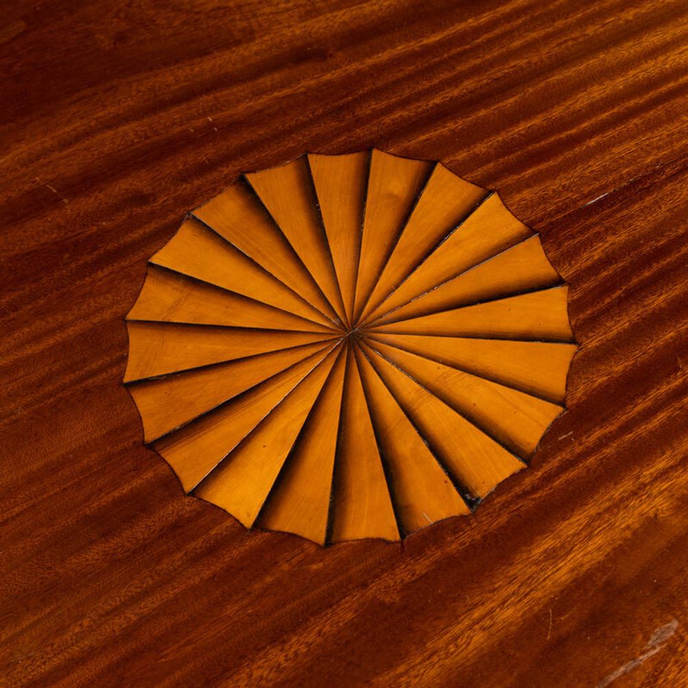 A Regency Style Mahogany and Marquetry Center Table