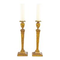 A Pair of Continental Gilt Iron Candlesticks