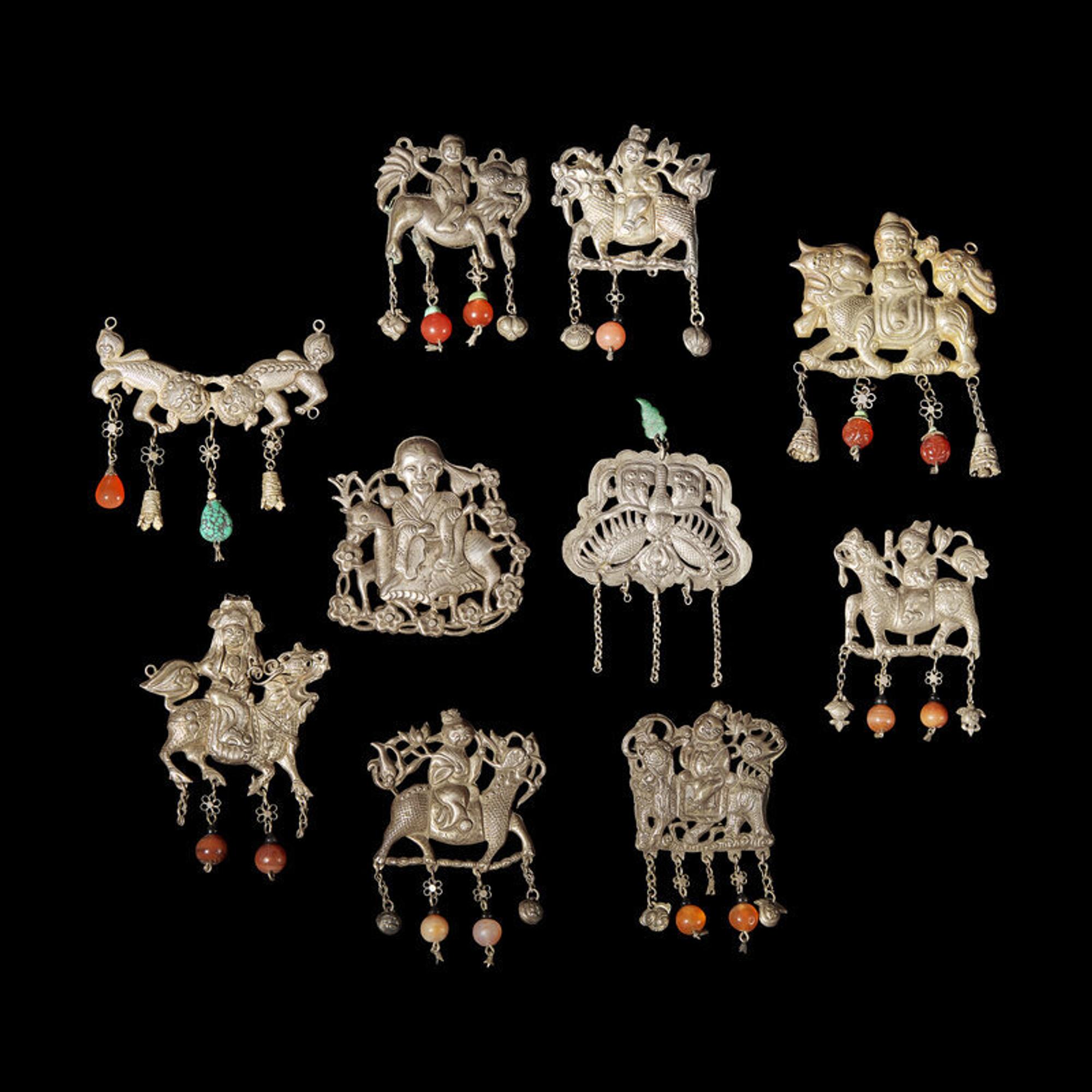 A Group of 10 Assorted Chinese Silver 'Boy and Qilin' Pendants, Late Qing Dynasty-Republic Period 晚清-民國 銀麒麟送子墜瑪瑙長命鎖及其他一組十件