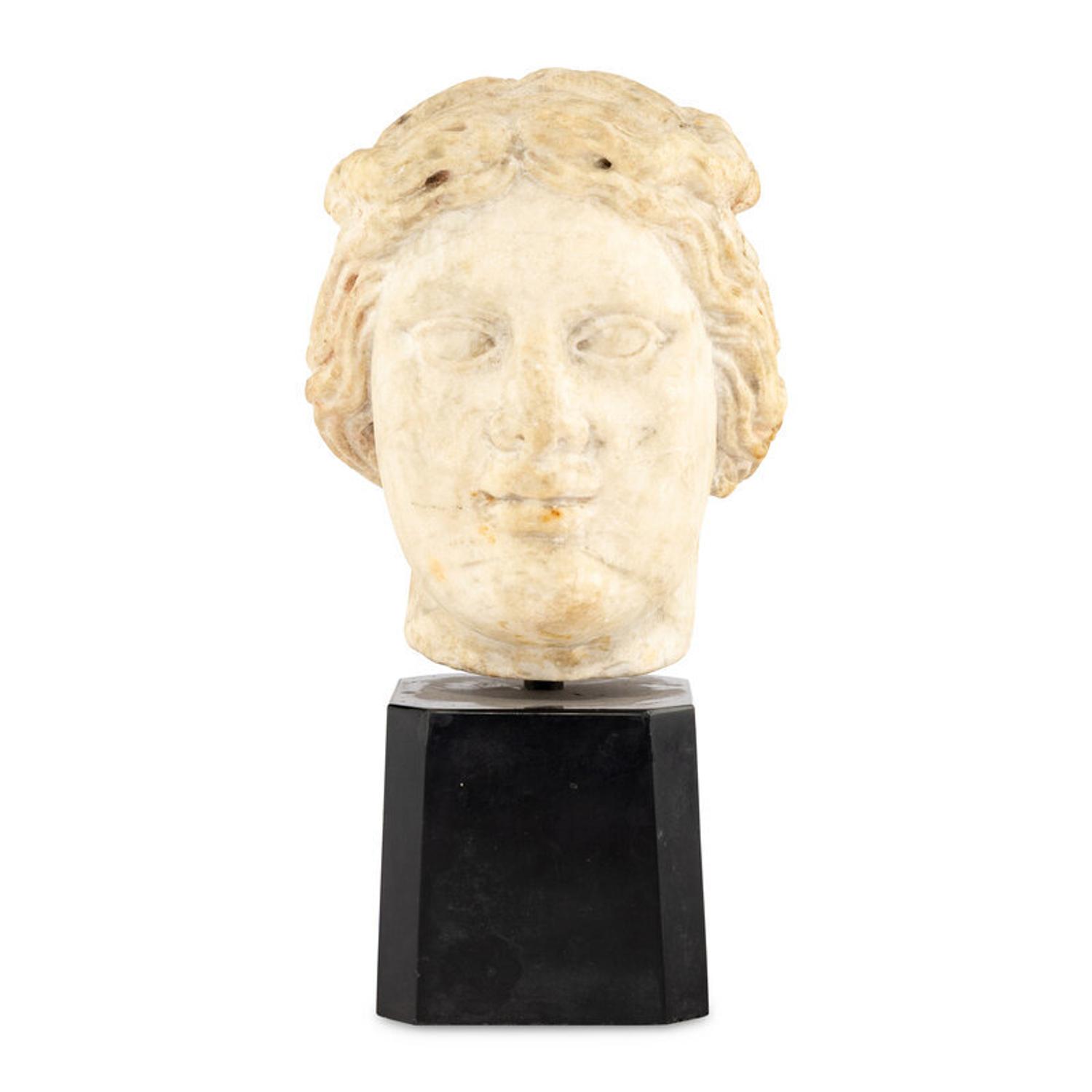 A Continental Carved Marble Head of a Woman