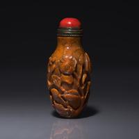 A Chinese Bird and Flower-Carved Root Amber Snuff Bottle 琥珀雕花鳥鼻烟壺