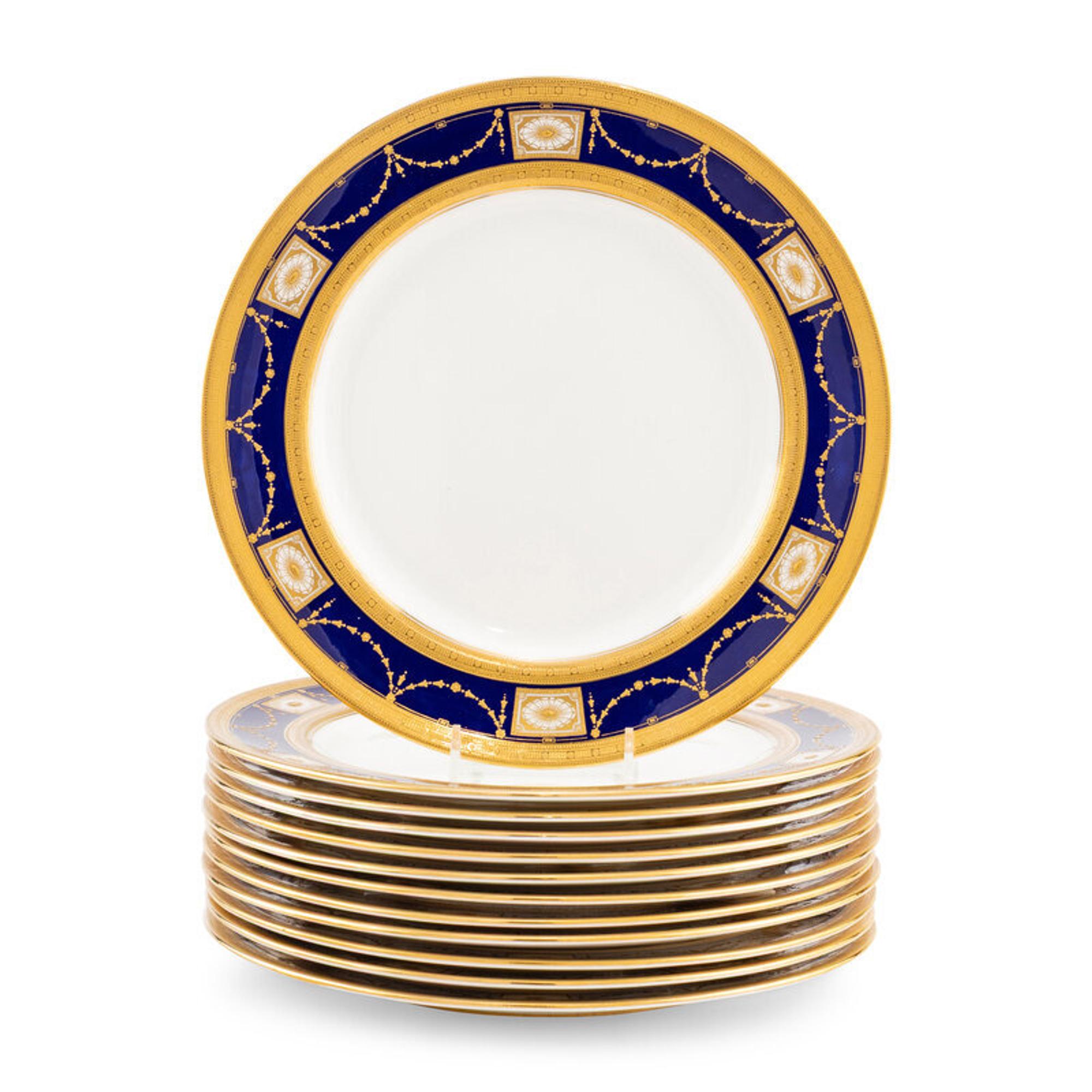 A Set of Twelve Royal Doulton Parcel Gilt Porcelain Dinner Plates