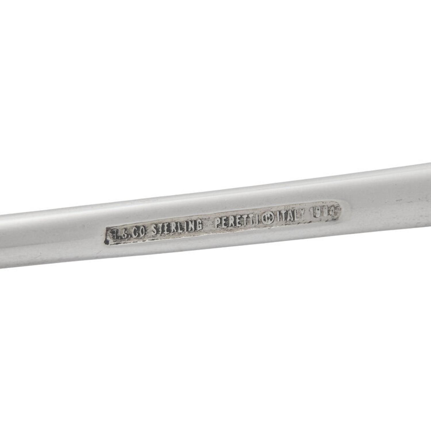 A Tiffany and Co. Silver Candle Snuffer