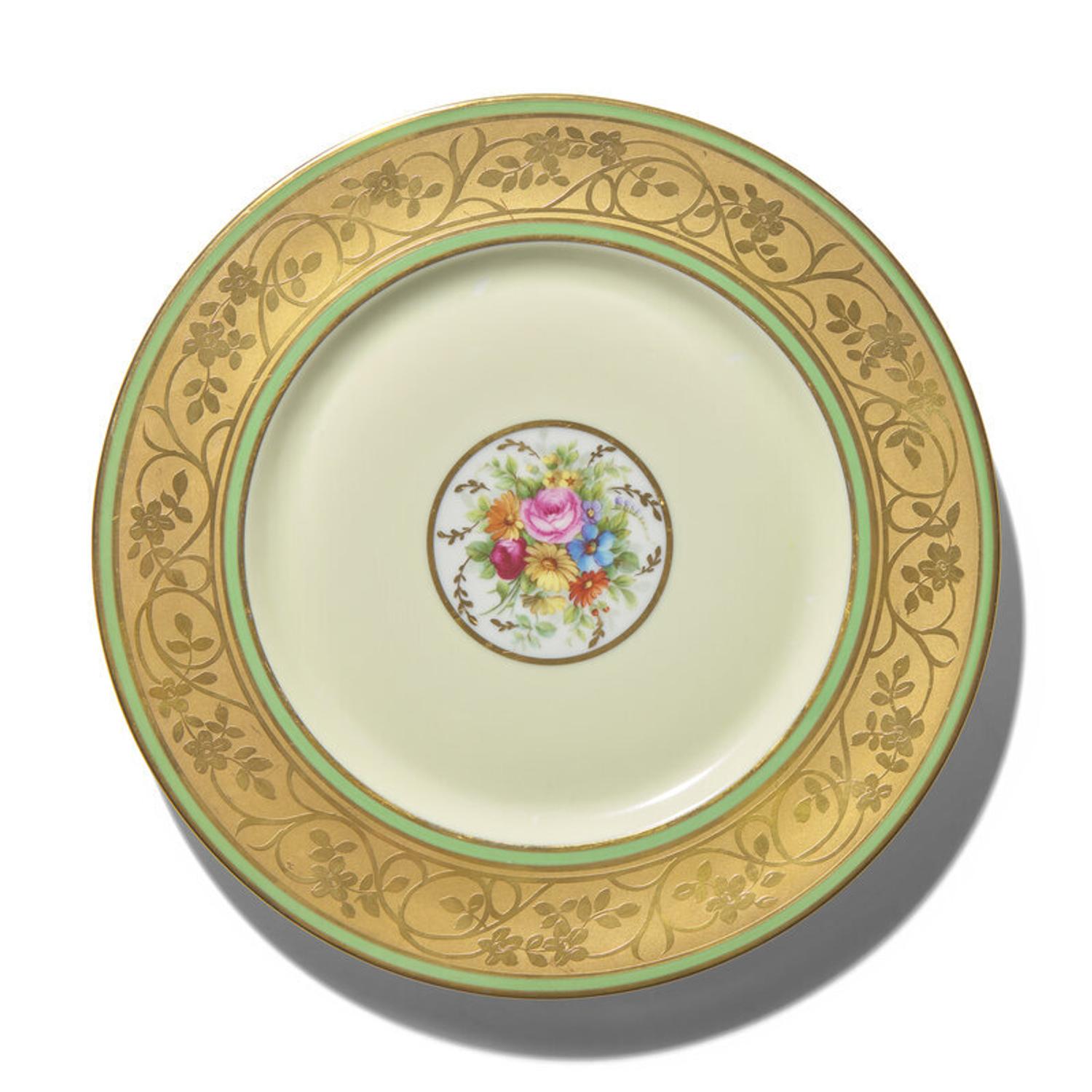 A Set of Twelve Limoges Porcelain Chargers