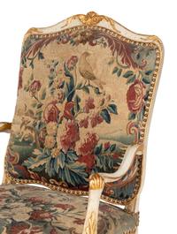 A Set of Four Louis XV White-Painted and Parcel Gilt Tapestry-Upholstered Fauteuils