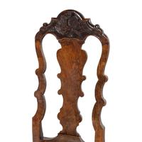 A Set of Three Dutch Carved Walnut Side Chairs