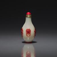 A Chinese Miniature Red-Overlaid Opaline Glass Snuff Bottle, Circa 1750-1820 1750-1820年 涅白地套寶石紅料螭龍紋小鼻烟壺