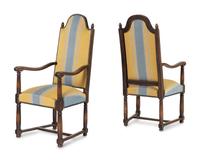 A Pair of French Provincial Carved Oak Fauteuils