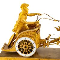 An Empire Gilt Bronze Figural Mantel Clock