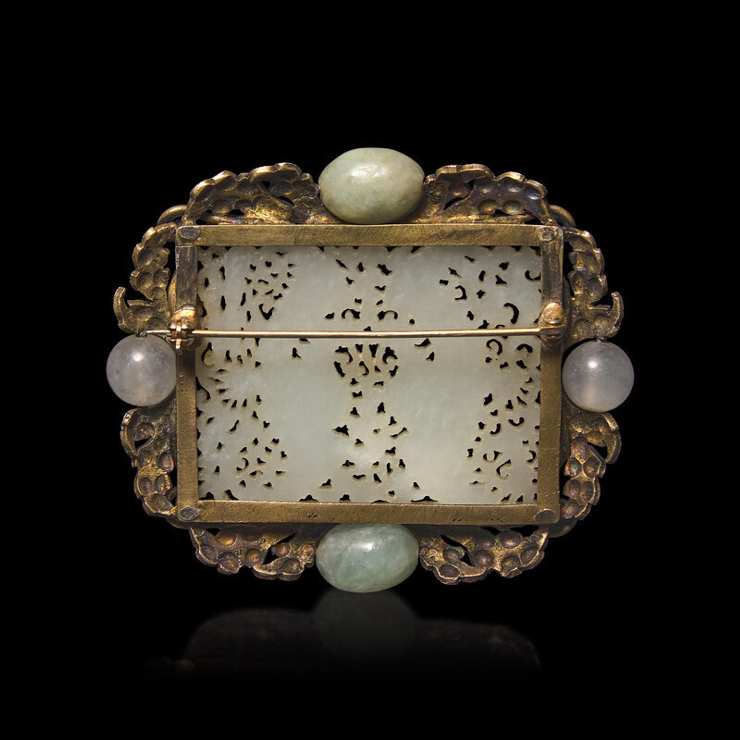 A Chinese White Jade 'Double Phoenix' Belt Plaque, Ming Dynasty 明 白玉鏤雕雙鳳紋帶板