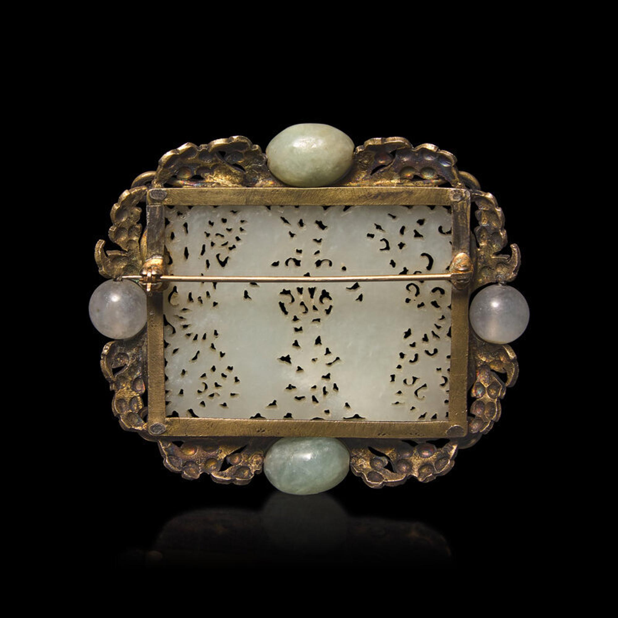 A Chinese White Jade 'Double Phoenix' Belt Plaque, Ming Dynasty 明 白玉鏤雕雙鳳紋帶板