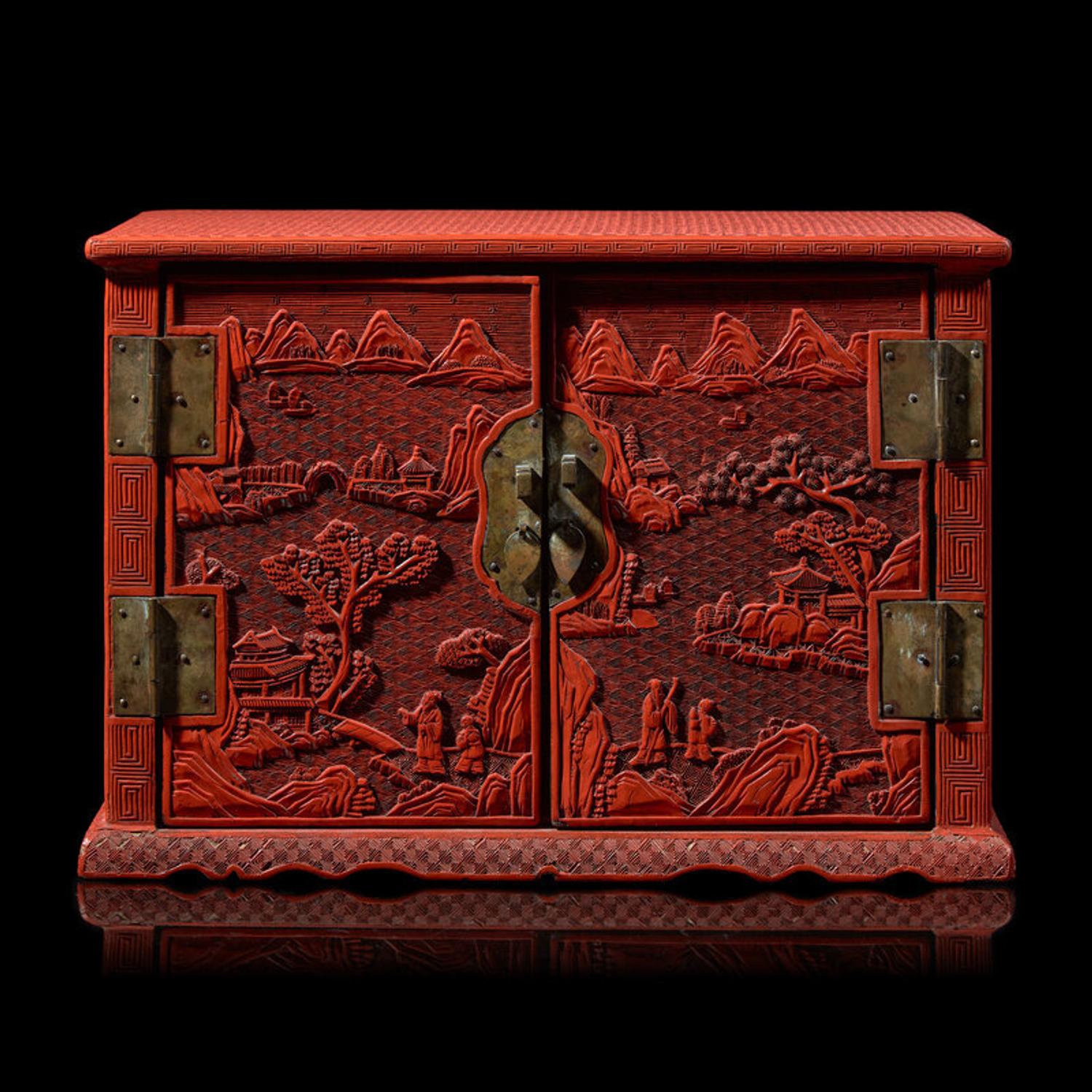 A Chinese Carved Cinnabar Lacquer Two-Door Small Cabinet, Late 19th/20th Century 清末民國 剔紅百寶箱