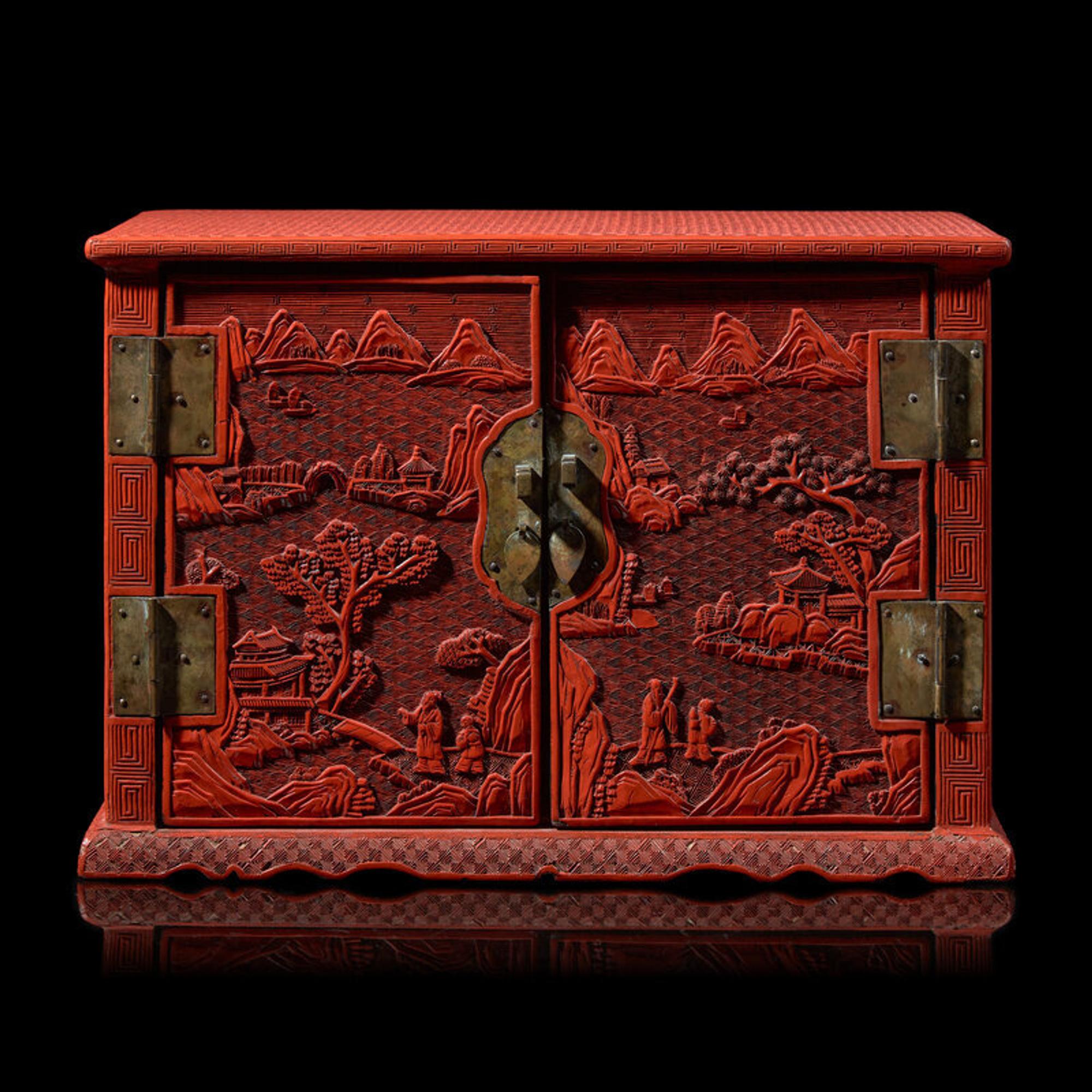A Chinese Carved Cinnabar Lacquer Two-Door Small Cabinet, Late 19th/20th Century 清末民國 剔紅百寶箱