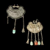 A Chinese Silver Necklace and Eight Chinese Silver Ruyi Lock-Form Pendants, Qing Dynasty 清 銀項圈一及銀如意頭形長命鎖一組八件