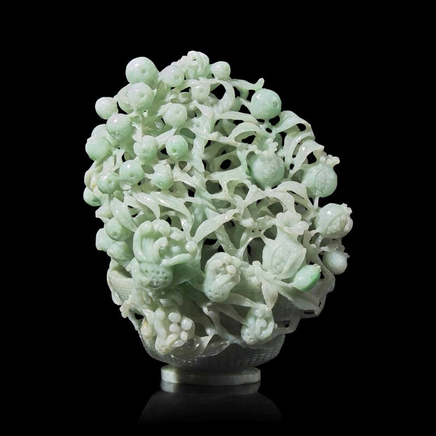 A Chinese Reticulated Jadeite "Sanduo" in Basket Group, 20th Century 近代 翡翠鏤雕三多擺件