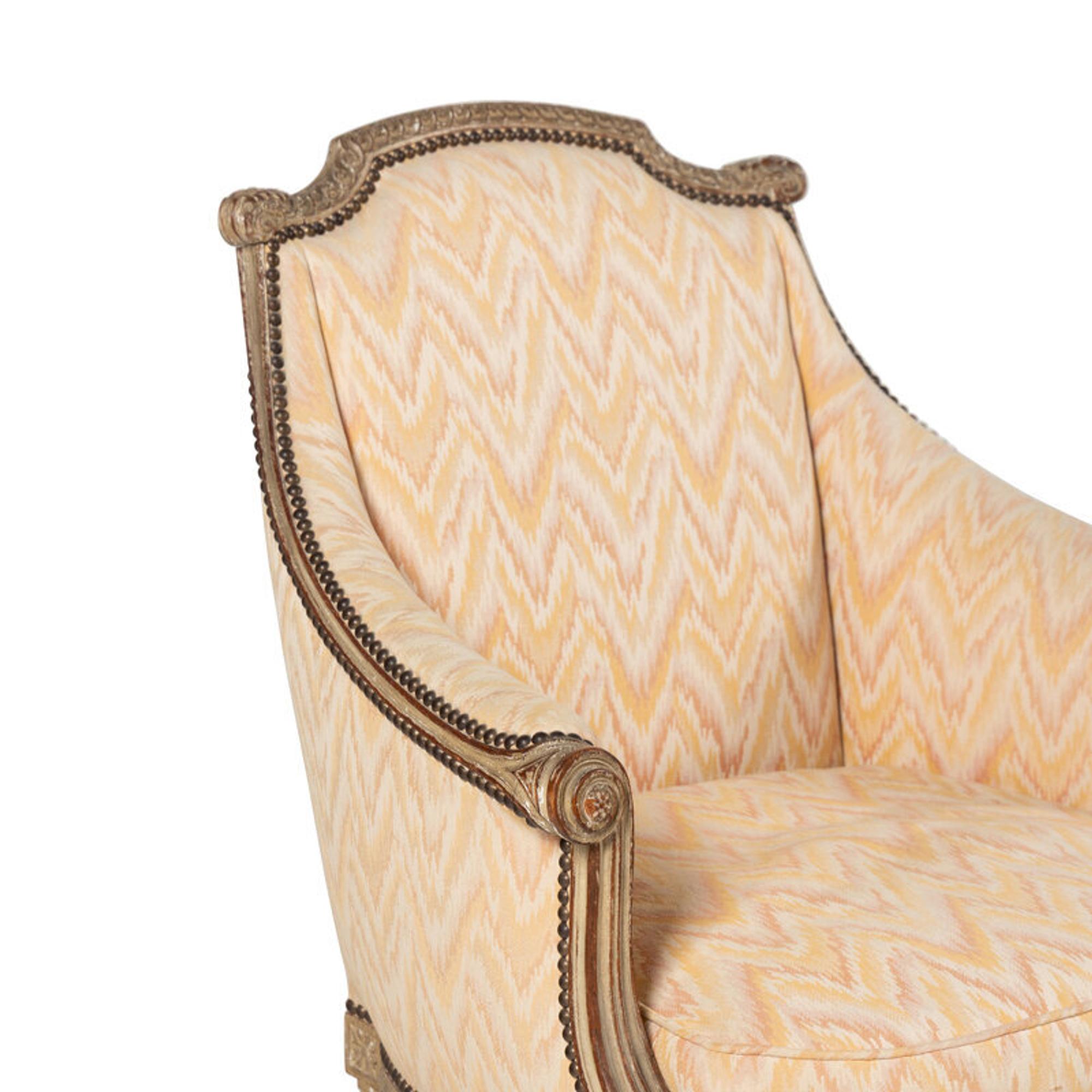 A Pair of Louis XVI Style Carved and Grey-Painted Bergères