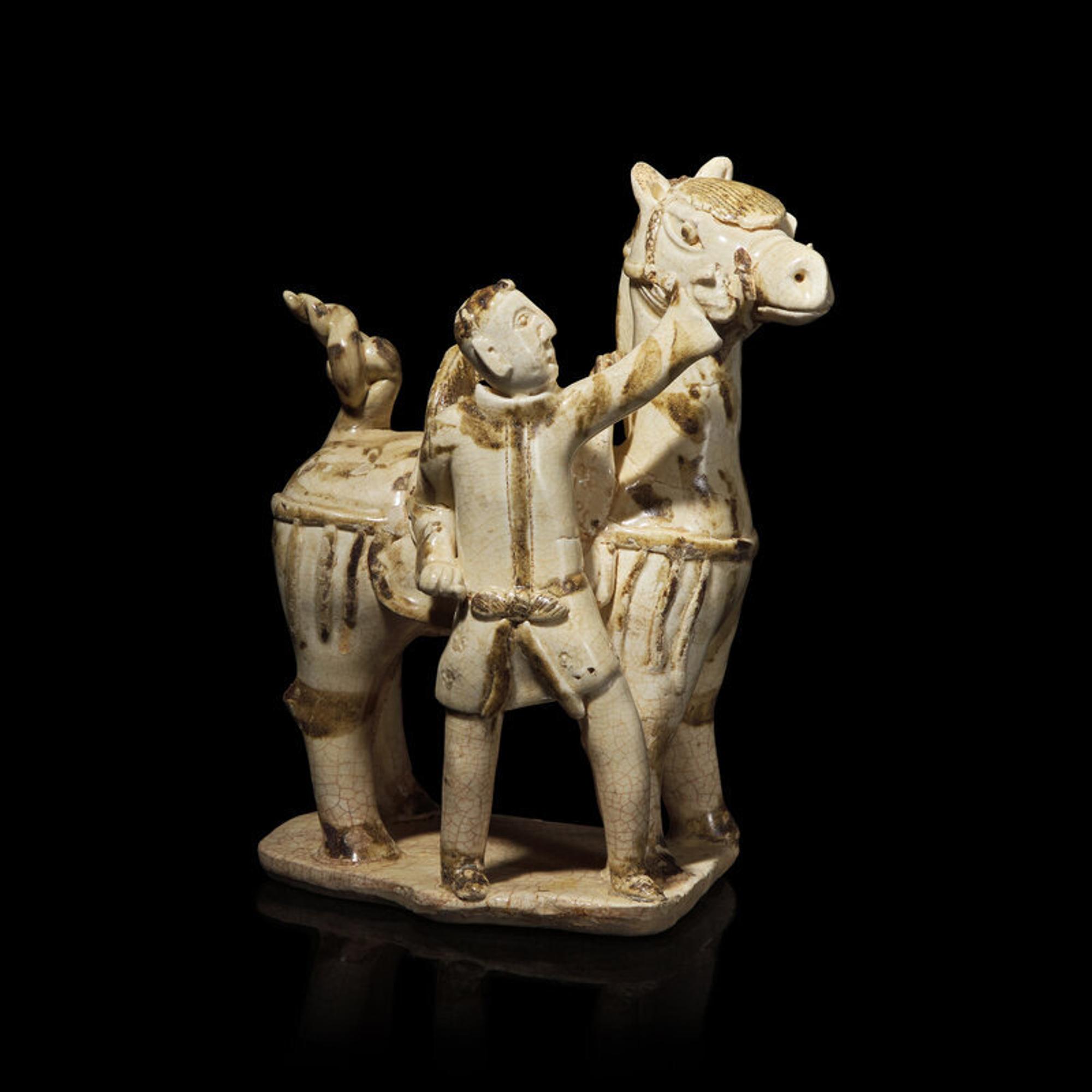 A Chinese Qingbai Iron-Brown Splashed Equestrian Figural Group, Northern Song Dynasty 北宋 湖田點褐彩胡人牽馬俑