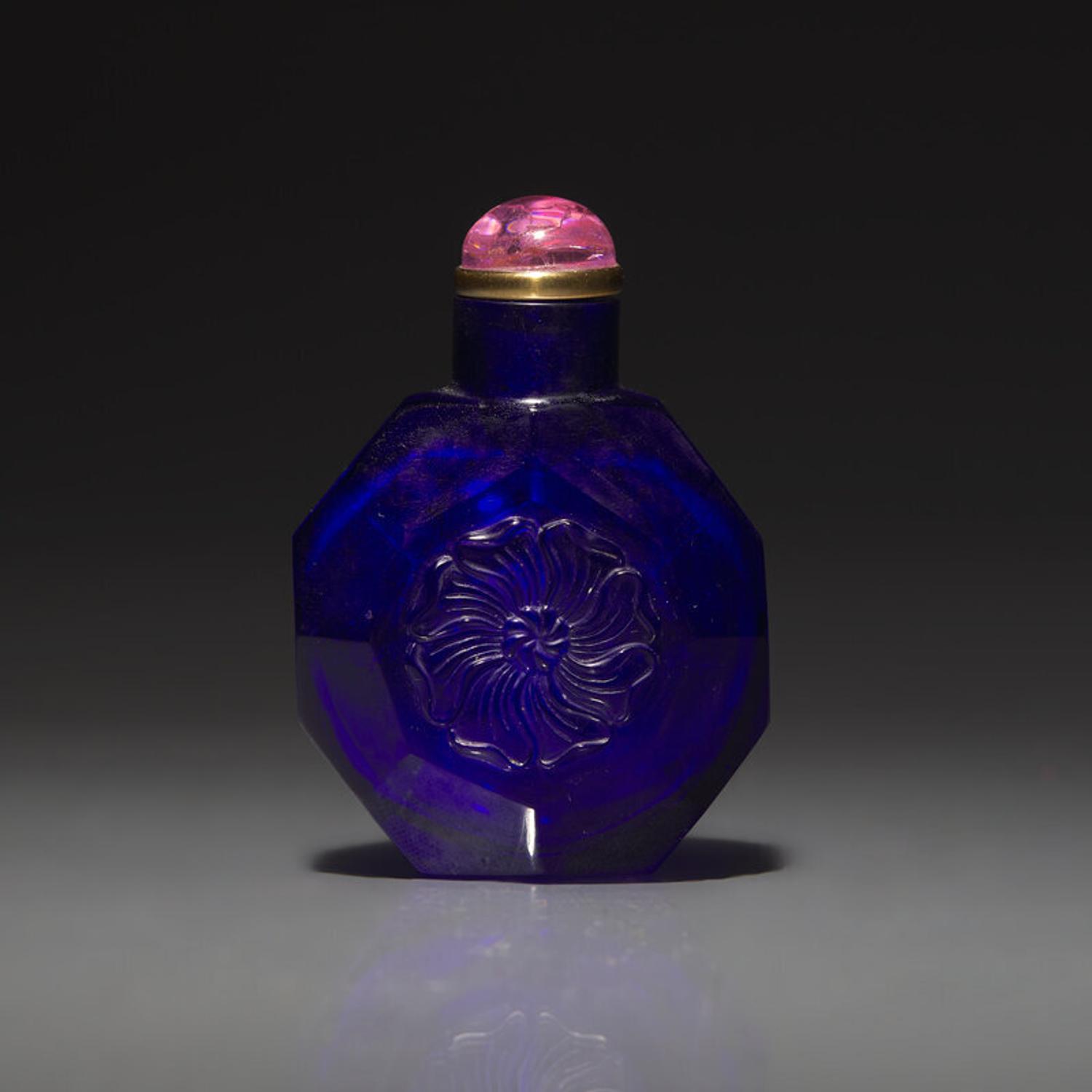 A Chinese Carved Cobalt Blue Glass Snuff Bottle, 18th Century 清中期 寶石藍料刻花鼻烟壺
