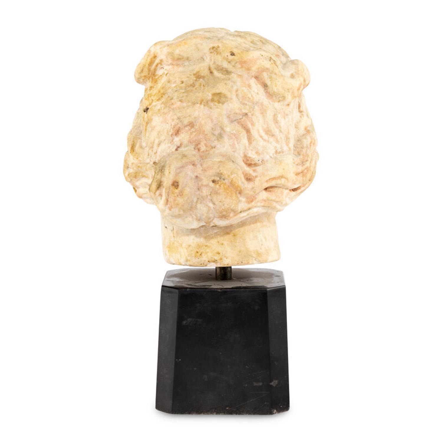 A Continental Carved Marble Head of a Woman