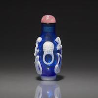 A Chinese White Overlay Blue Glass Snuff Bottle, Qing Dynasty, Possibly 18th-Early 19th Century 清中期 寶石藍地套涅白料垂釣圖鼻烟壺