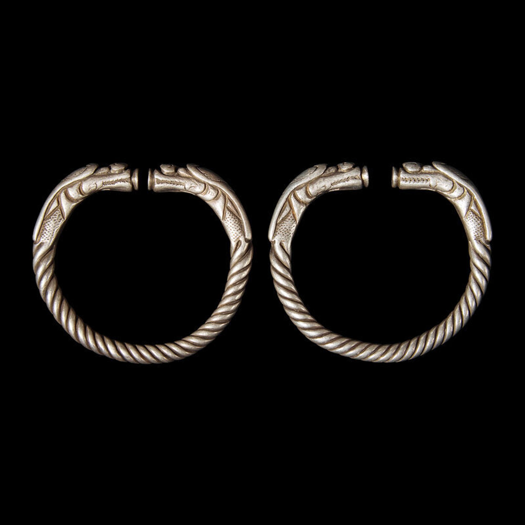 Six Chinese Silver 'Dragon' Bracelets, Qing Dynasty 清 銀龍頭紋鐲六隻