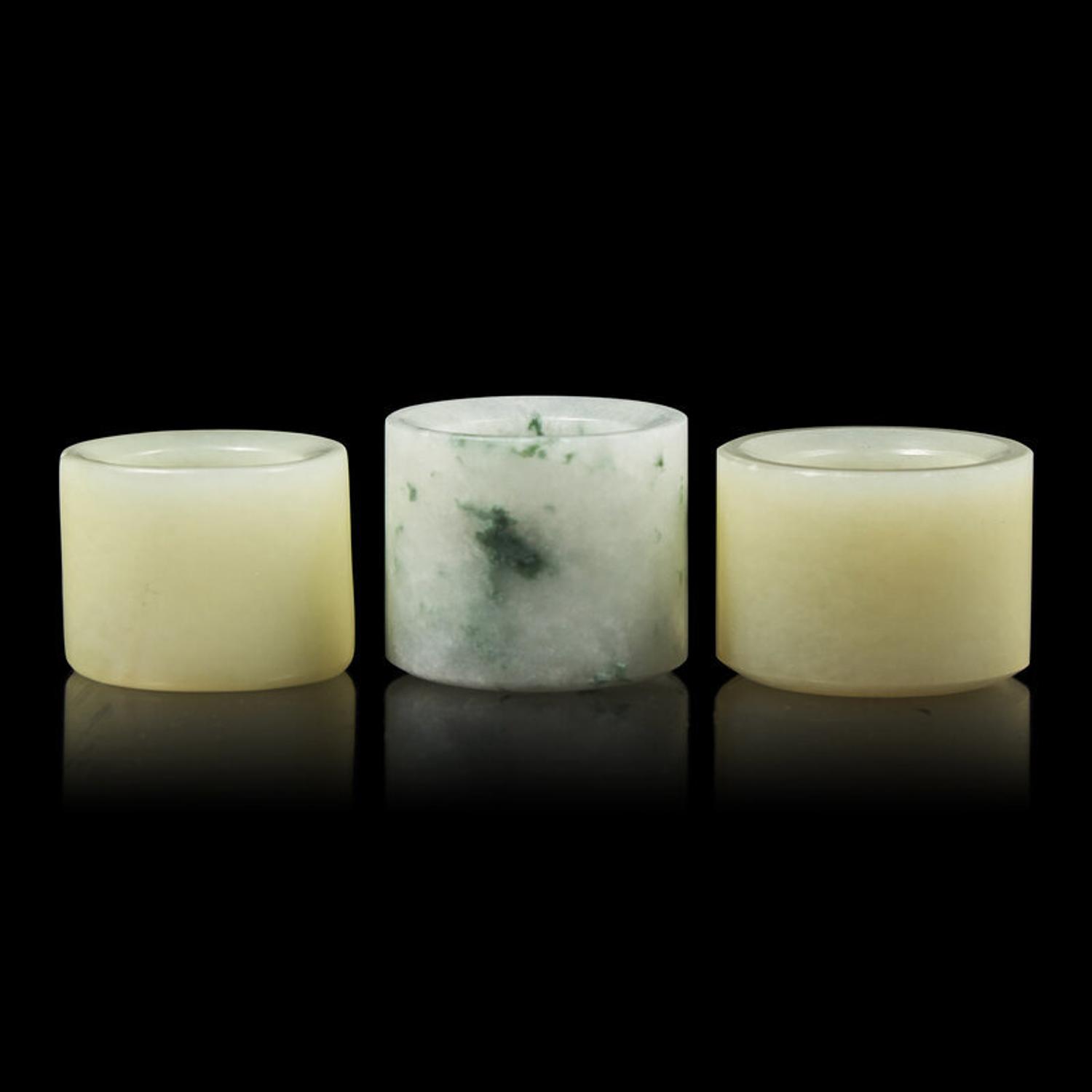 A Group of Three Chinese Jade and Jadeite Archer's Ring 翡翠及玉扳指一組三件