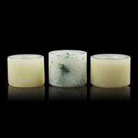 A Group of Three Chinese Jade and Jadeite Archer's Ring 翡翠及玉扳指一組三件