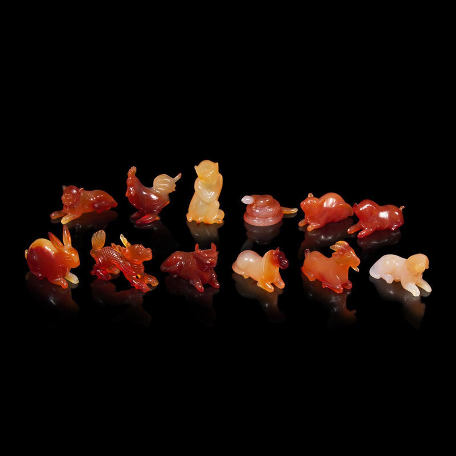 A Set of 12 Chinese Carved Agate Zodiac Figures, 20th Century 近代 瑪瑙雕生肖把件一組十二件