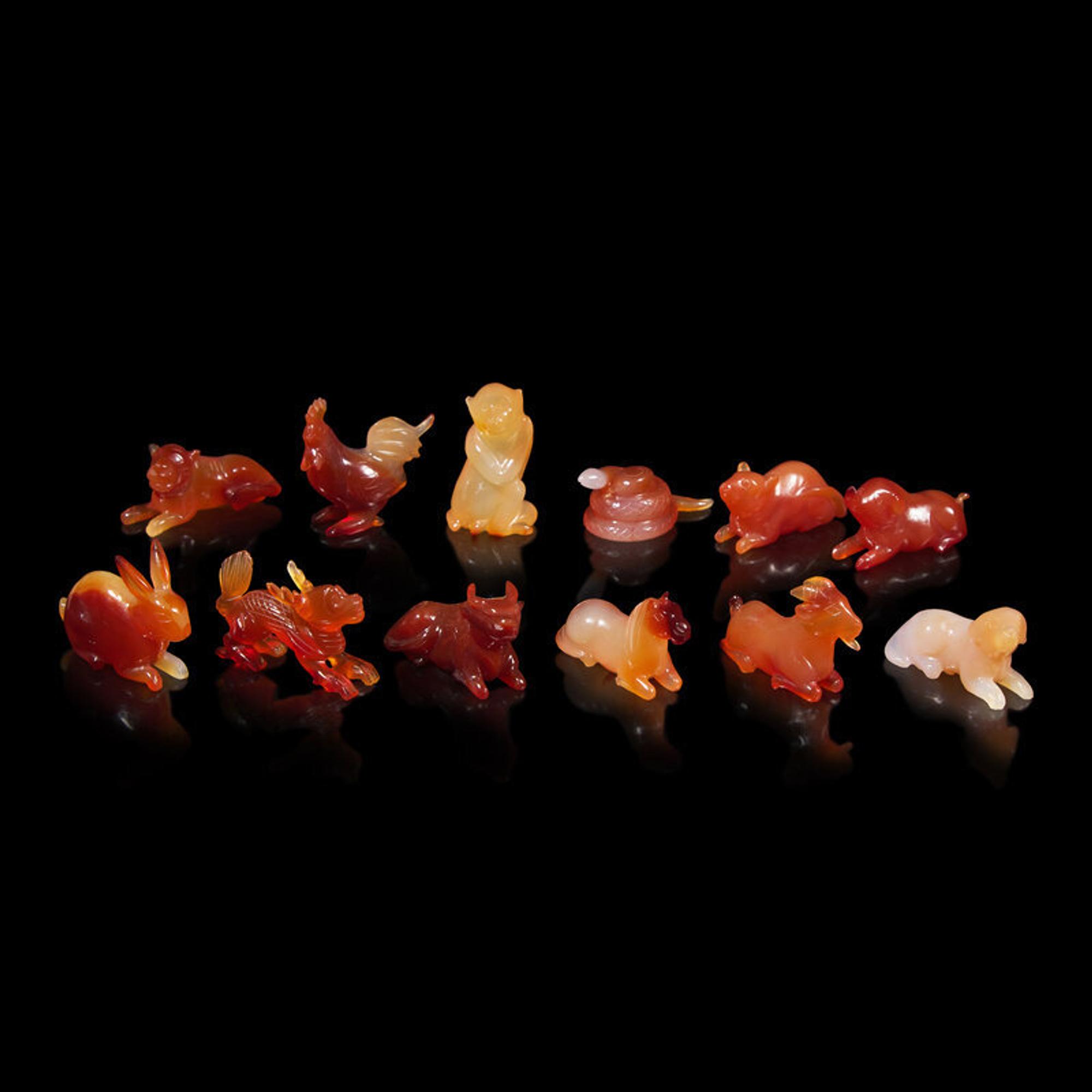 A Set of 12 Chinese Carved Agate Zodiac Figures, 20th Century 近代 瑪瑙雕生肖把件一組十二件