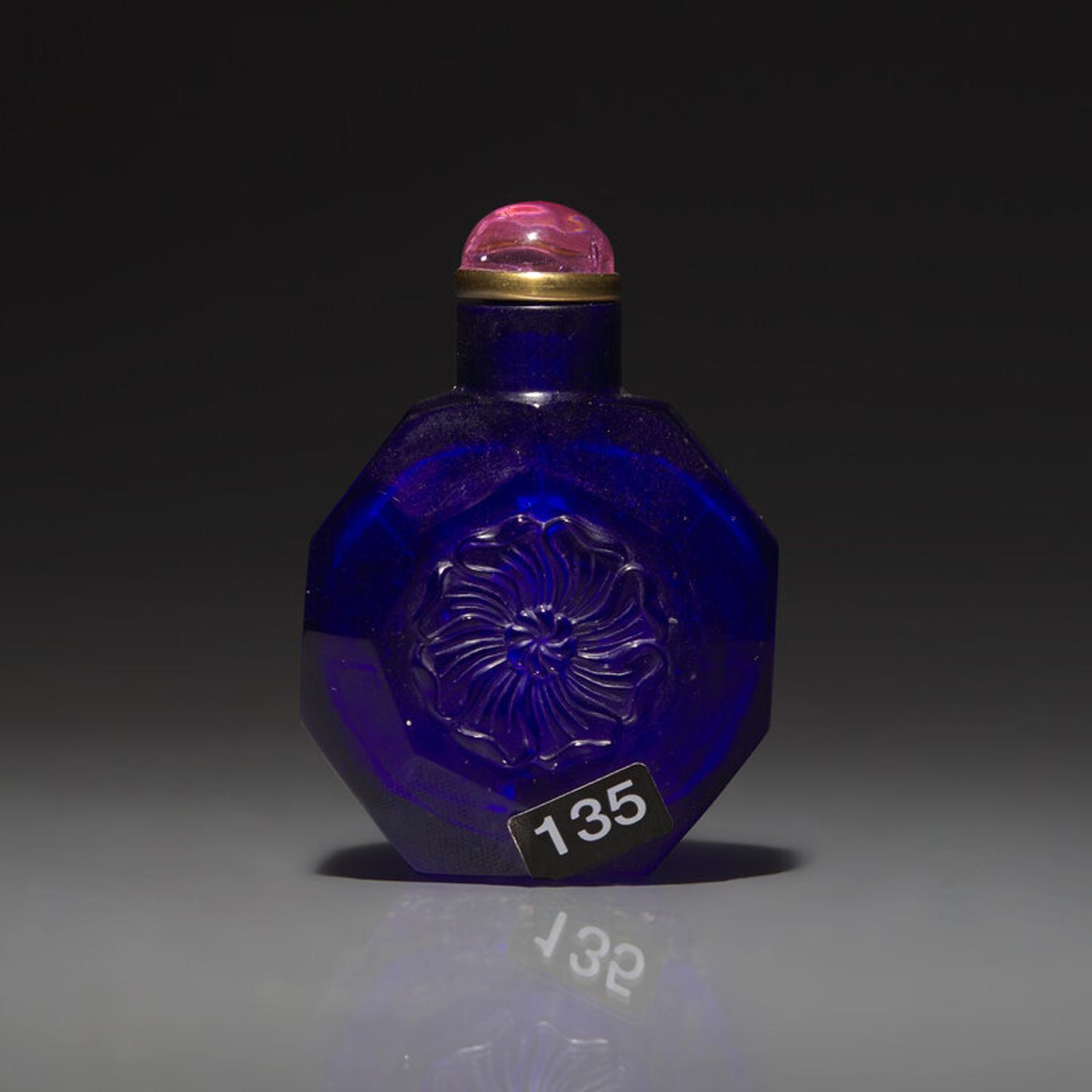 A Chinese Carved Cobalt Blue Glass Snuff Bottle, 18th Century 清中期 寶石藍料刻花鼻烟壺