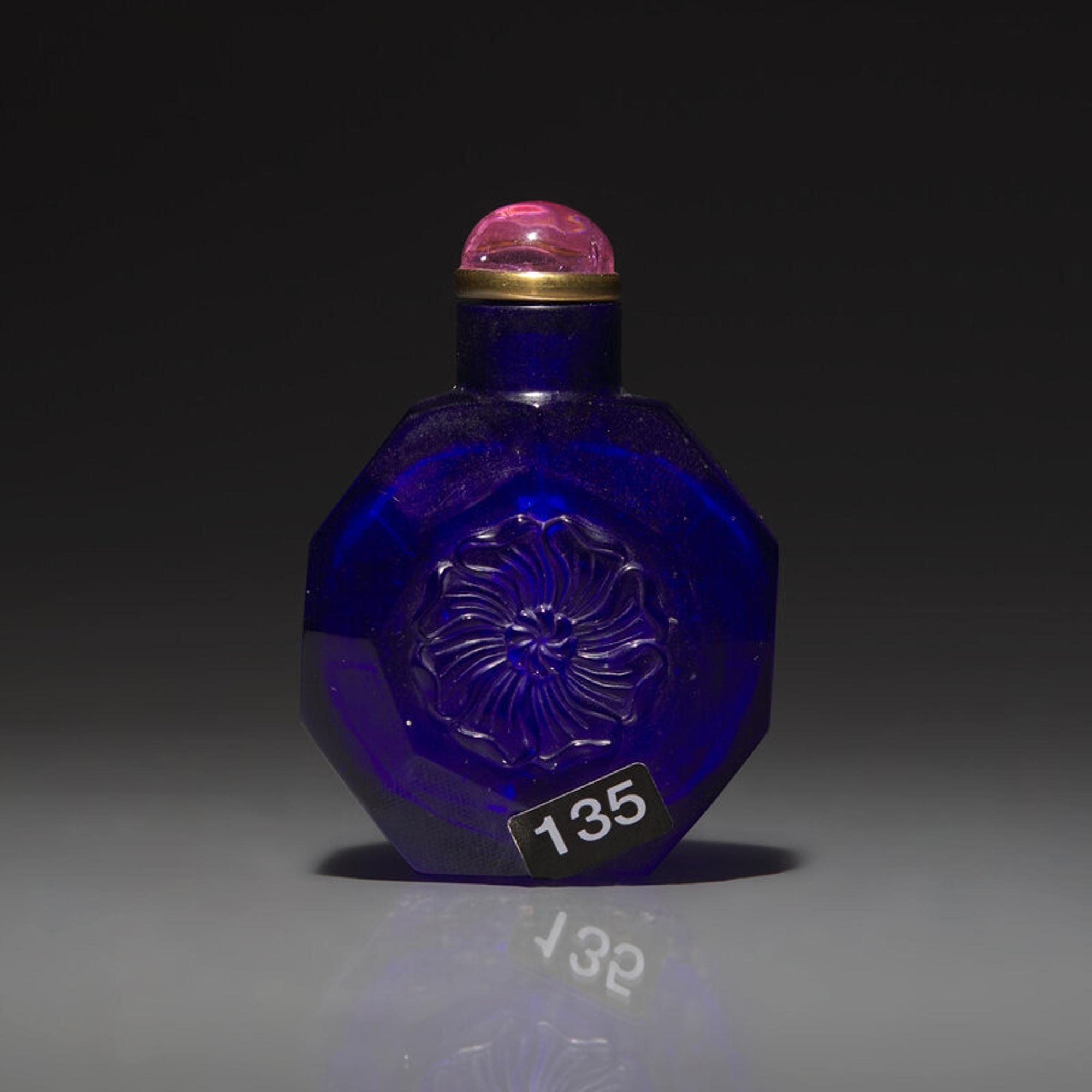 A Chinese Carved Cobalt Blue Glass Snuff Bottle, 18th Century 清中期 寶石藍料刻花鼻烟壺