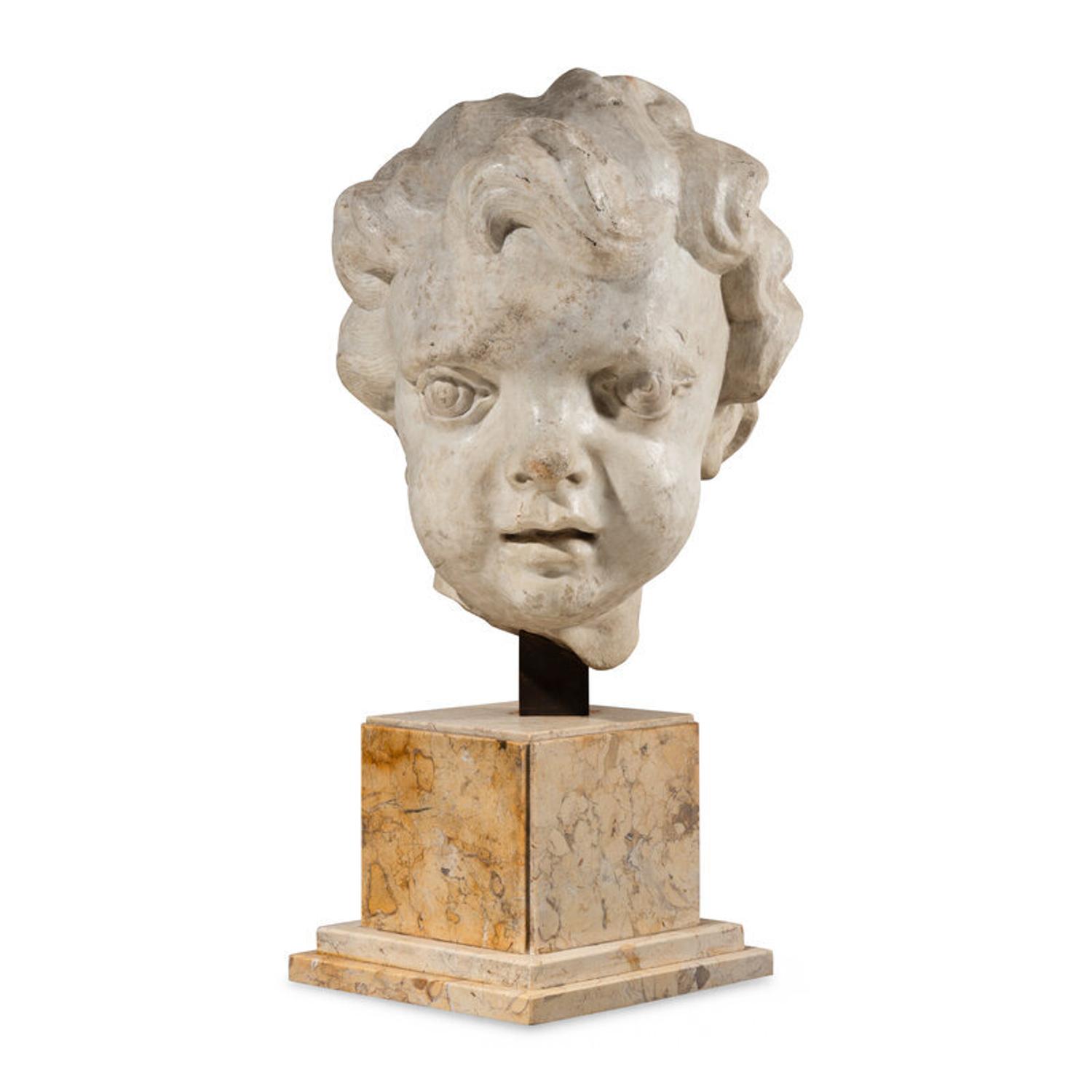 A Large Italian Marble Head of a Putto