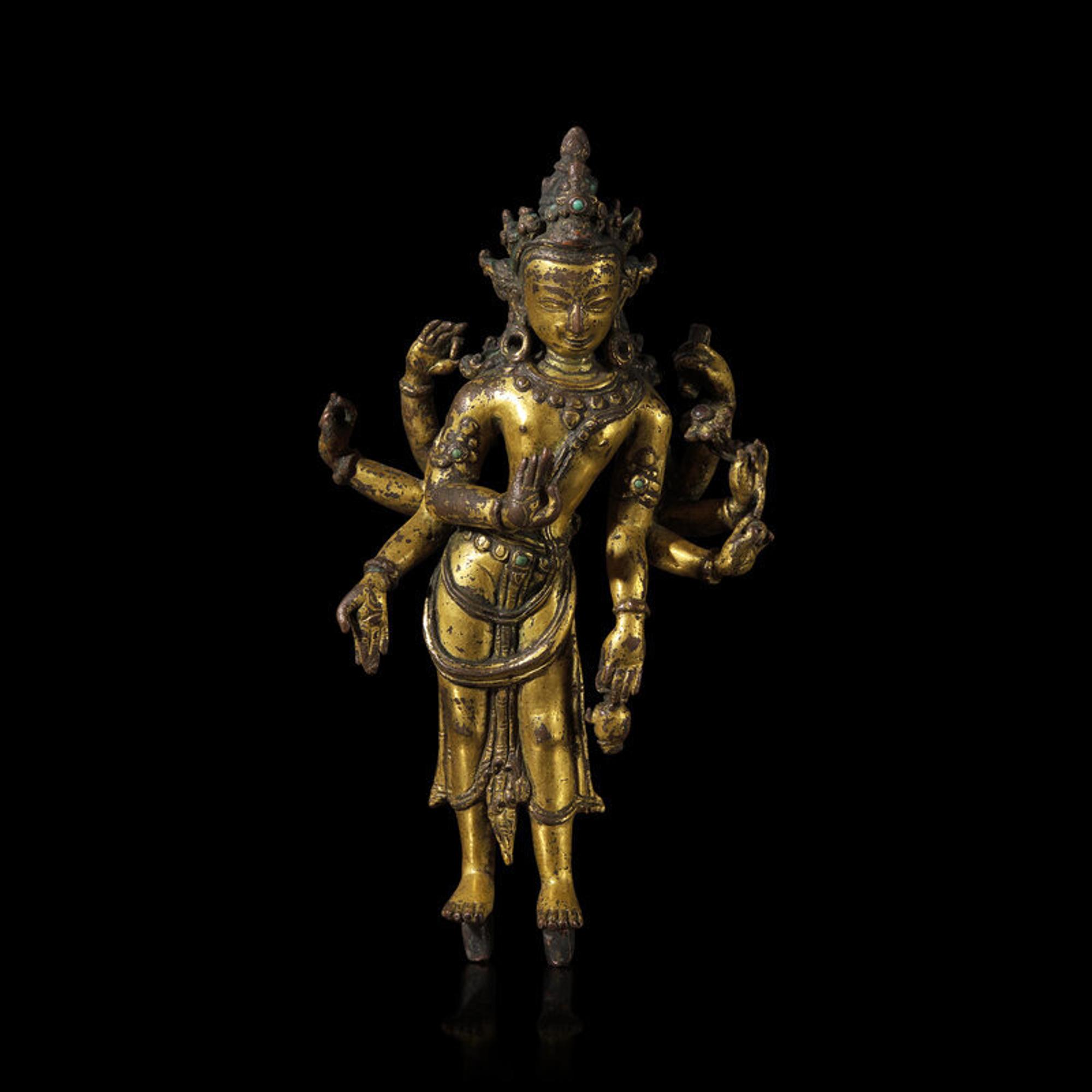 A Nepalese Gilt Bronnze Standing Figure of Avalokiteshvara, 14th/15th Century 十四/十五世紀 尼泊爾銅鎏金菩薩立像