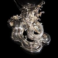A Japanese Rock Crystal Sphere and Silver 'Dragon and Waves' Stand, Signed Yoshimasa Saku Meiji/Taisho Period 日本明治/大正時期 義正作潮を支配する珠と龍